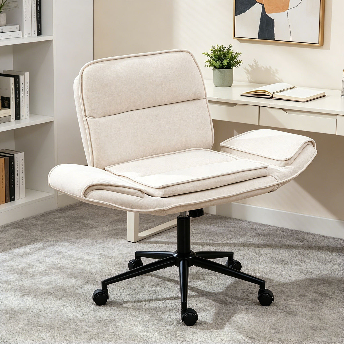 Beige fabric swivel desk chair with adjustable armrests and wheeled base