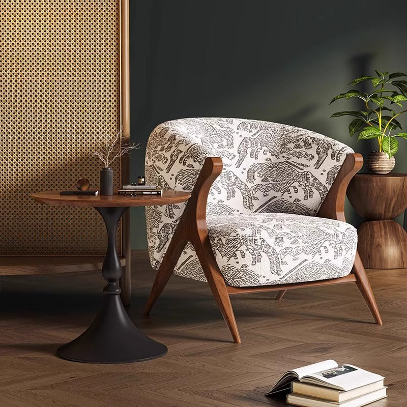 Patterned lounge chair with wood arms and curved back, white and dark print