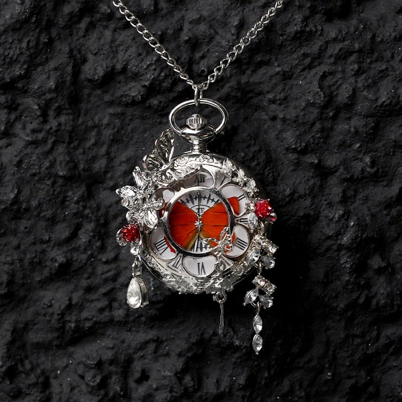 Butterfly pocket watch pendant necklace with red butterfly centerpiece and dangling crystal charms