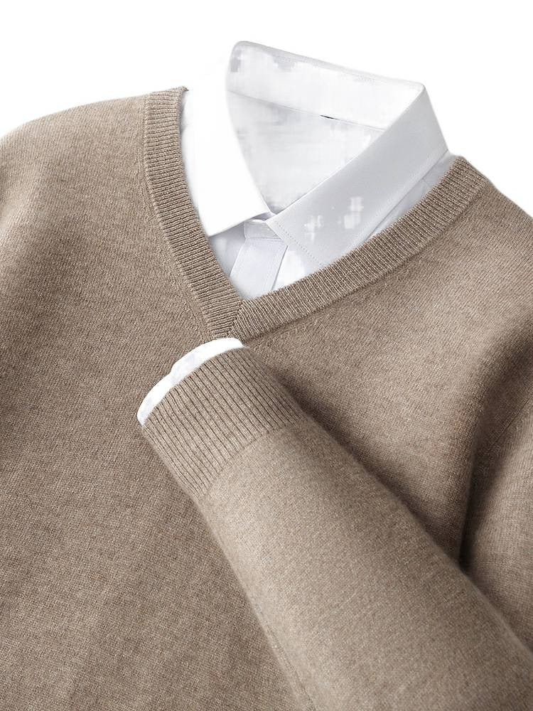 Camel-brown V-neck cashmere sweater close-up with ribbed neckline and cuffs