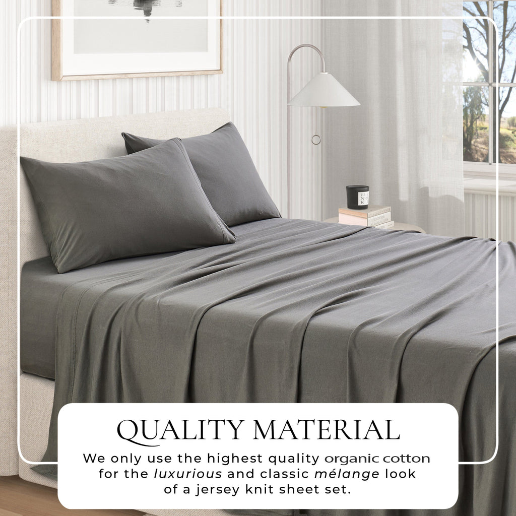 Grey jersey knit sheet set on bed with two pillowcases and quality callout overlay