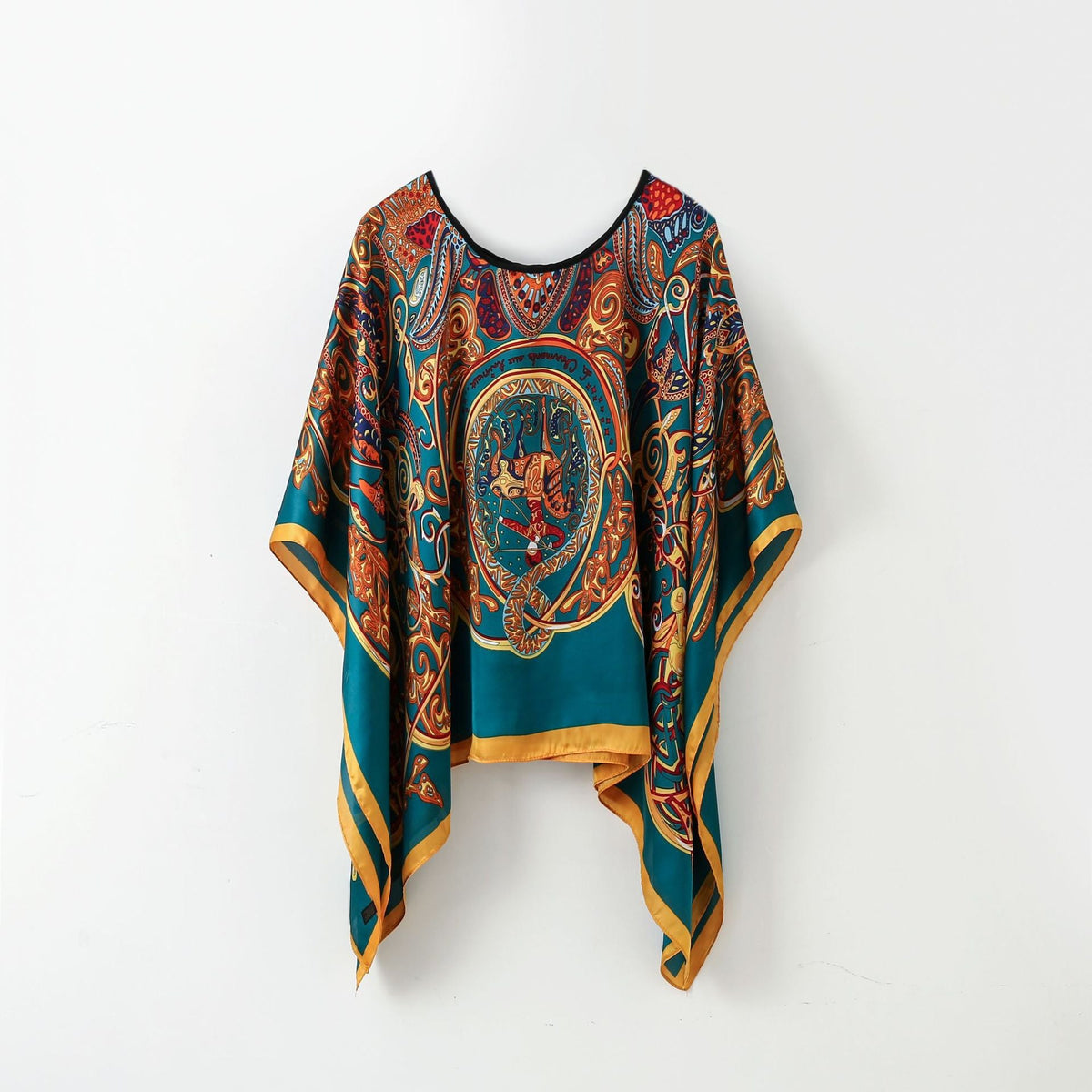 Blue-and-gold ornate paisley poncho-style pullover shawl scarf with black neckline