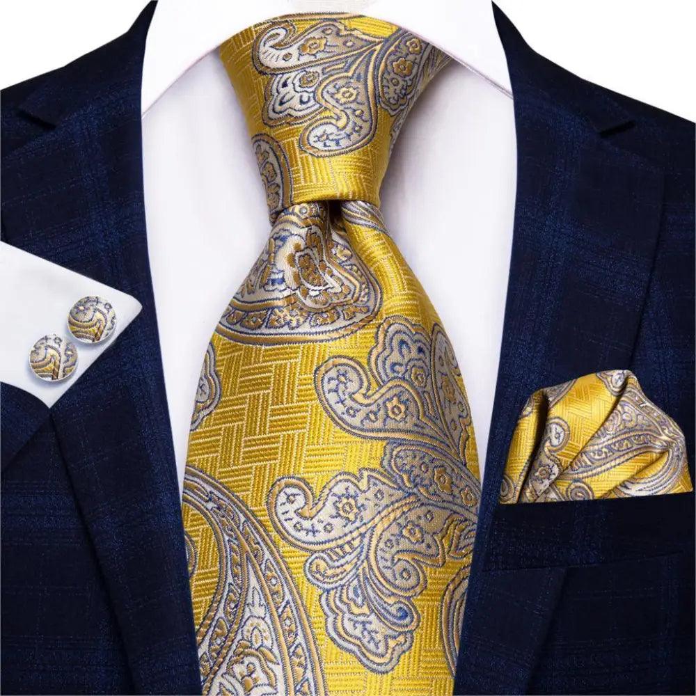 Men's gold and blue paisley tie set with matching pocket square and cufflinks
