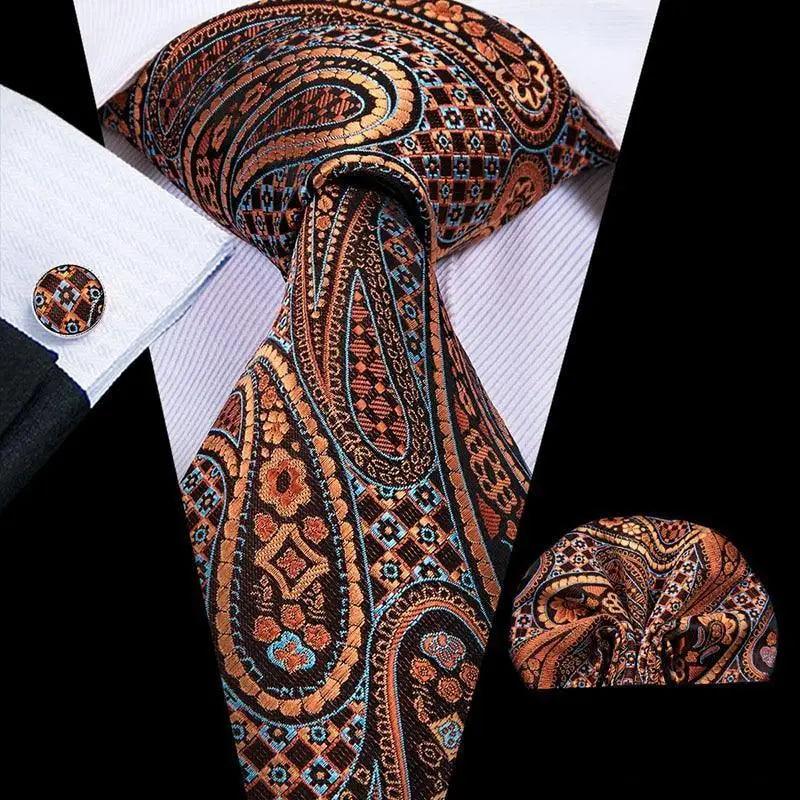 Men's orange and navy paisley tie set with matching pocket square and cufflinks