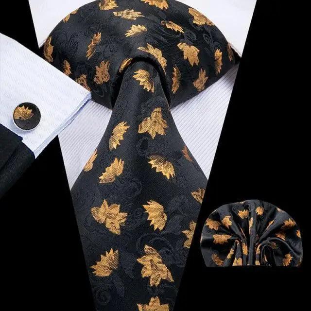 Men's black tie with gold leaf pattern set with pocket square and cufflinks