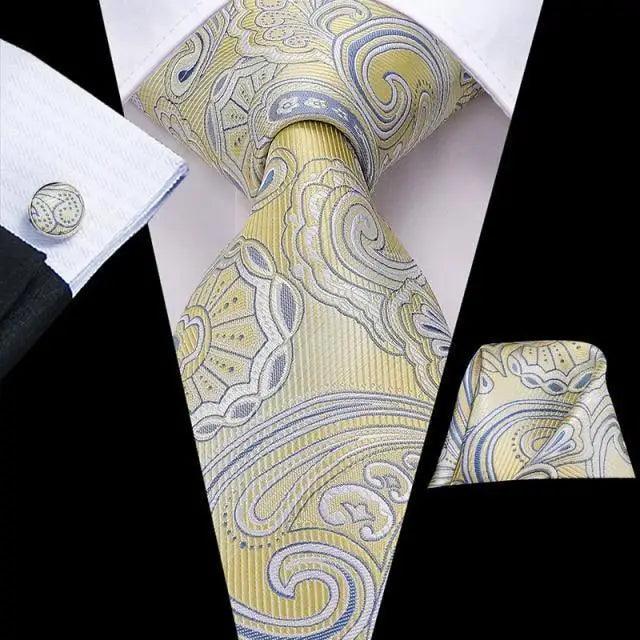 Men's light gold paisley tie set with matching pocket square and cufflinks