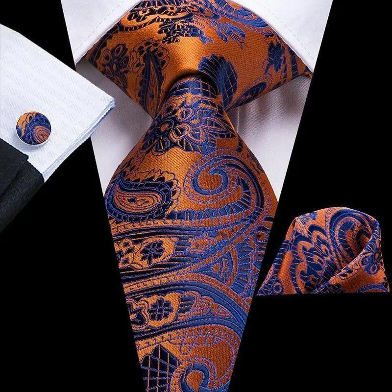 Men's orange and blue paisley tie set with matching pocket square and cufflinks