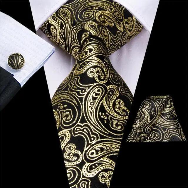 Men's black and gold swirl tie set with matching pocket square and cufflinks