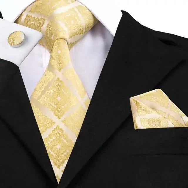 Men's pale gold patterned tie set with matching pocket square and cufflinks