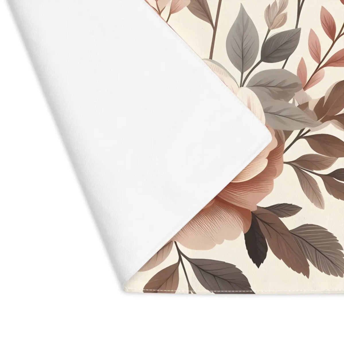 Cotton placemat corner showing floral print side and white reverse backing