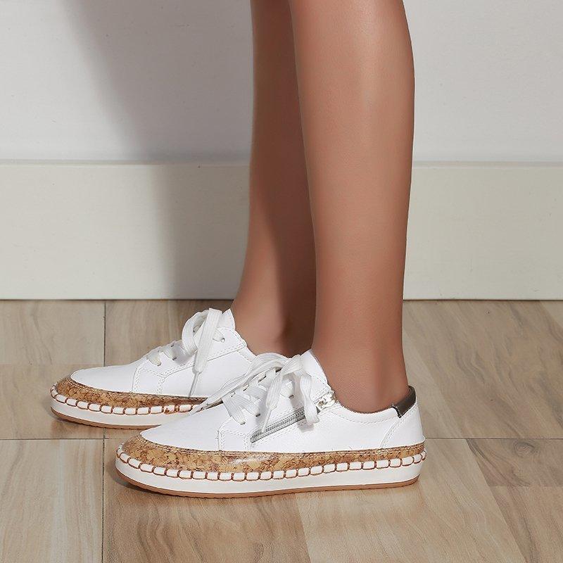White lace-up women’s sneaker, round toe, decorative tan rope-style sole