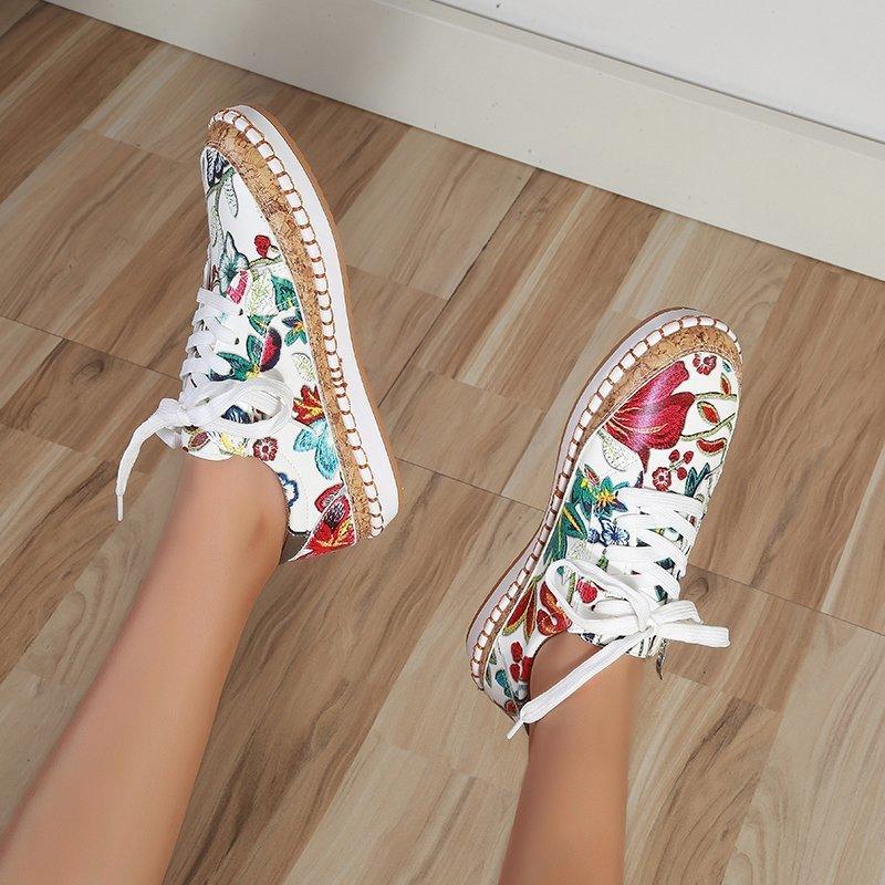 Women’s floral lace-up sneakers with white upper and multicolor cuff details