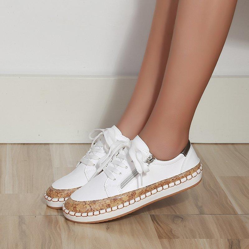 Women’s white lace-up sneakers with brown textured platform sole