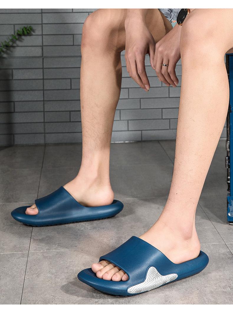 Blue EVA slide sandals on feet with open toe and textured footbed pattern