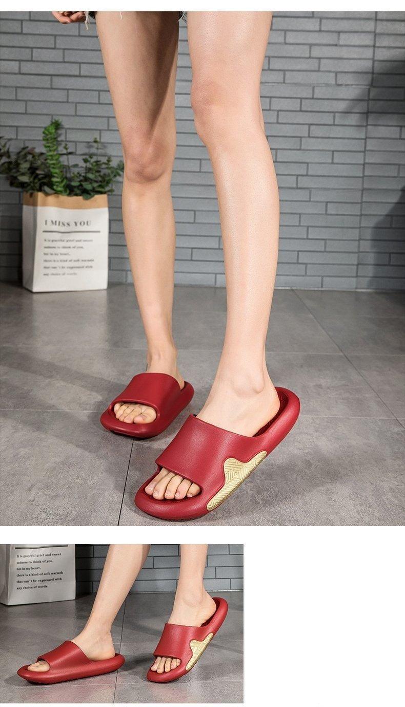Red EVA slide sandals worn on feet with cushioned straps and textured anti-slip sole