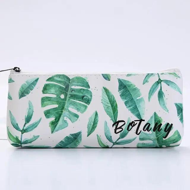 White pencil case pouch with green tropical leaf print and black zipper