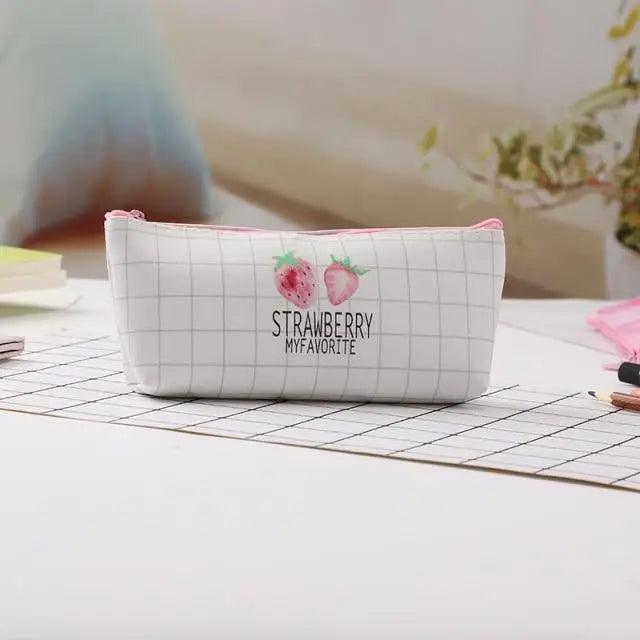 White zip pencil pouch with pink grid design and “Strawberry” text