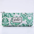 White and green tropical leaf pencil case pouch with "hello" label and black zipper