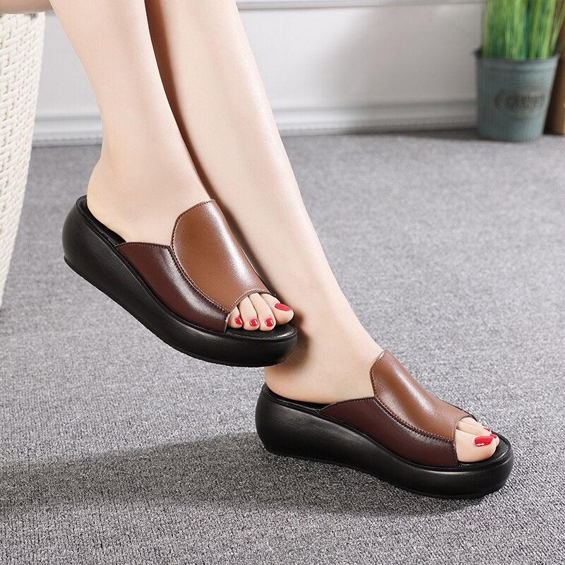 Brown leather platform wedge slip-on sandals with open toe and red-painted nails