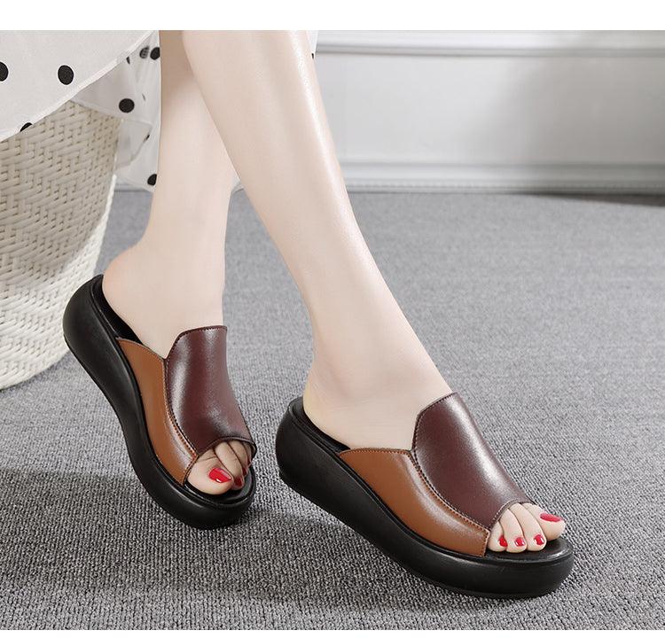 Brown leather platform wedge slip-on sandals with peep toe and textured red nails