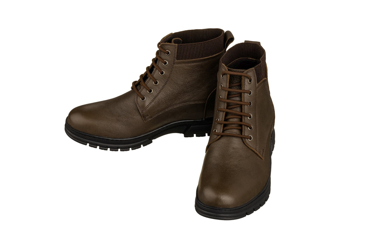 Pair of chocolate brown lace-up work boots in side view with black outsoles