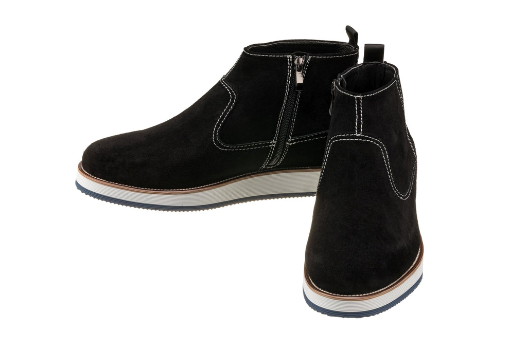 Black nubuck ankle zipper boots with thick white sole and brown welt trim