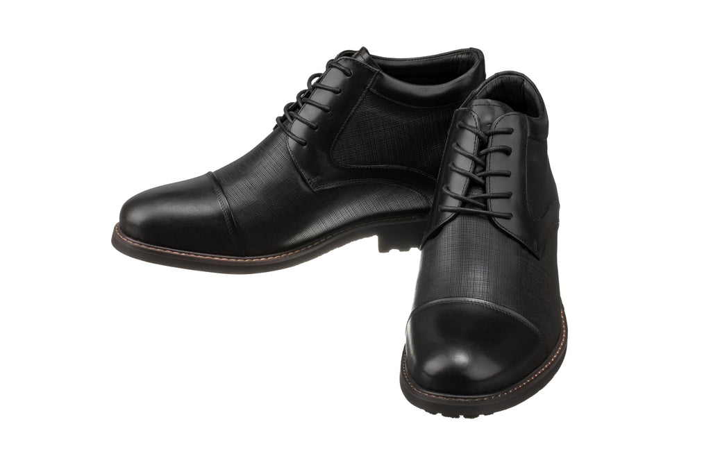 Pair of black leather lace-up boots with rounded toe and low heel