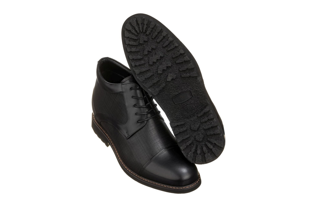 Black leather lace-up boot sole with treaded outsole and stitched edge