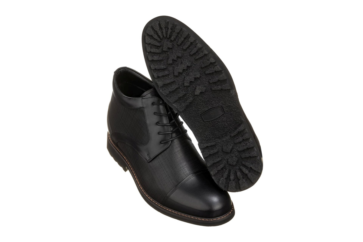 Black leather lace-up boot sole with treaded outsole and stitched edge
