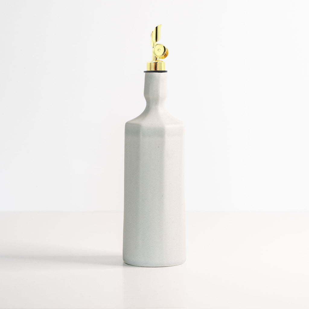 Smoke grey porcelain olive oil dispenser with gold pump and narrow nozzle