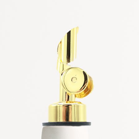 Gold-toned pump top for porcelain olive oil dispenser with black wick nozzle