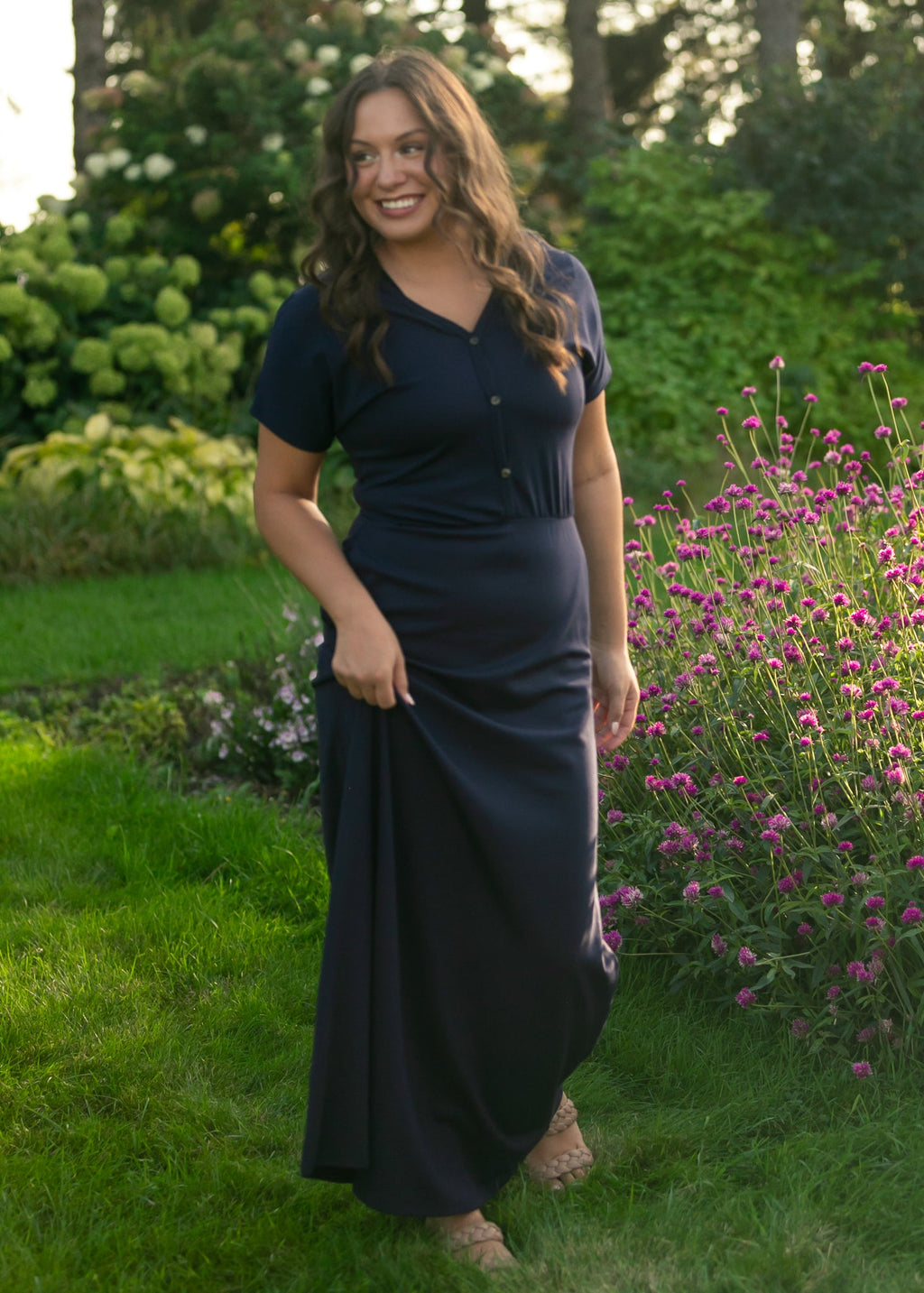 Dark navy maxi dress with V-neck button placket, short sleeves, and gathered waist.