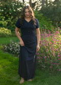 Navy cinched-waist maxi dress with V-neck, button front, and short sleeves.
