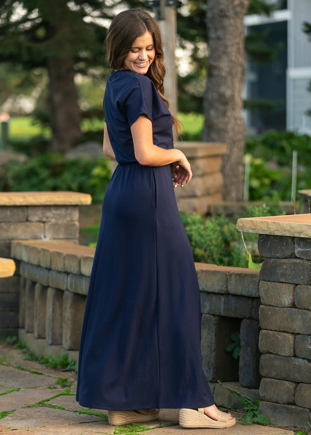 Navy button-front maxi dress with cinched waist and short sleeves, side view