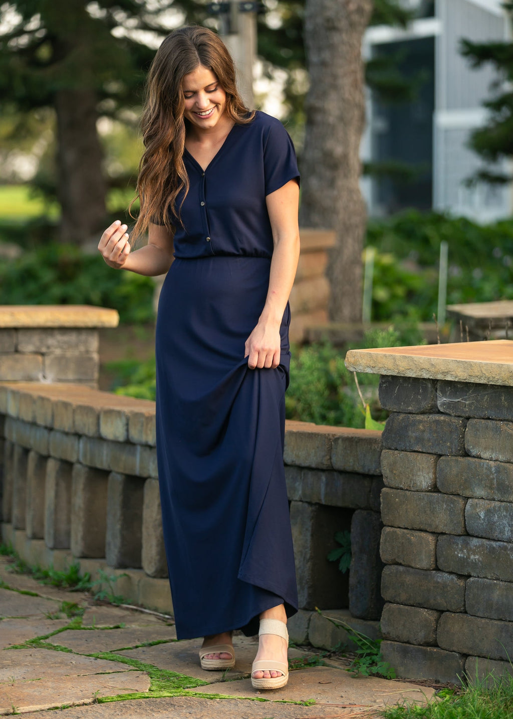 Navy cinched-waist maxi dress with short sleeves and button-front V-neck