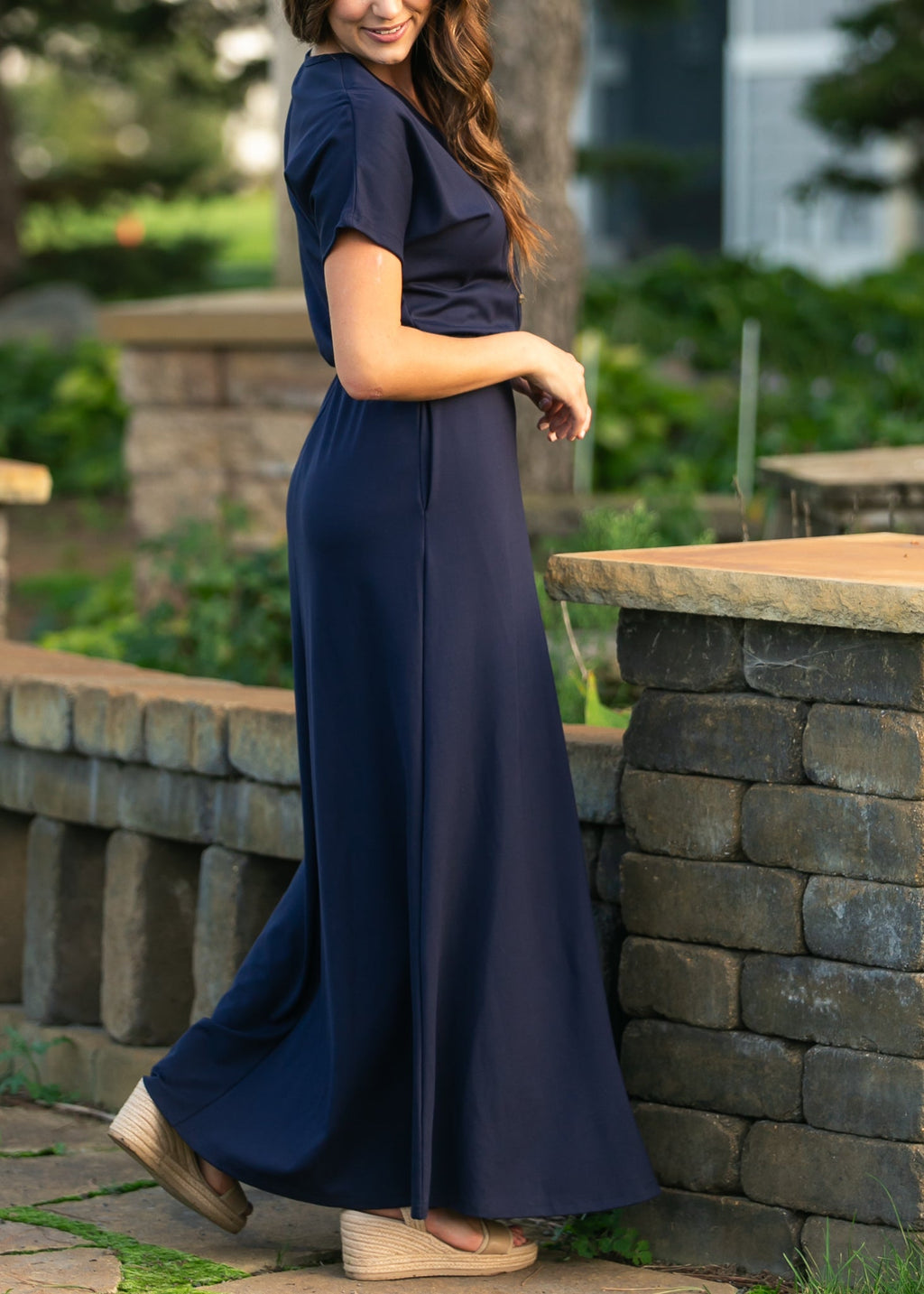 Navy maxi dress with cinched waist, short sleeves, and button-front V-neck