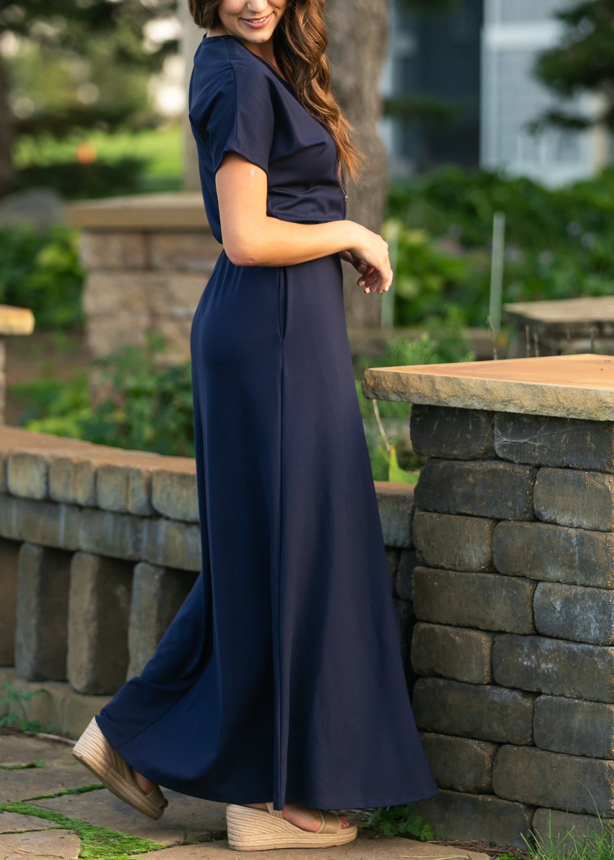 Navy maxi dress with cinched waist, short sleeves, and button-front V-neck