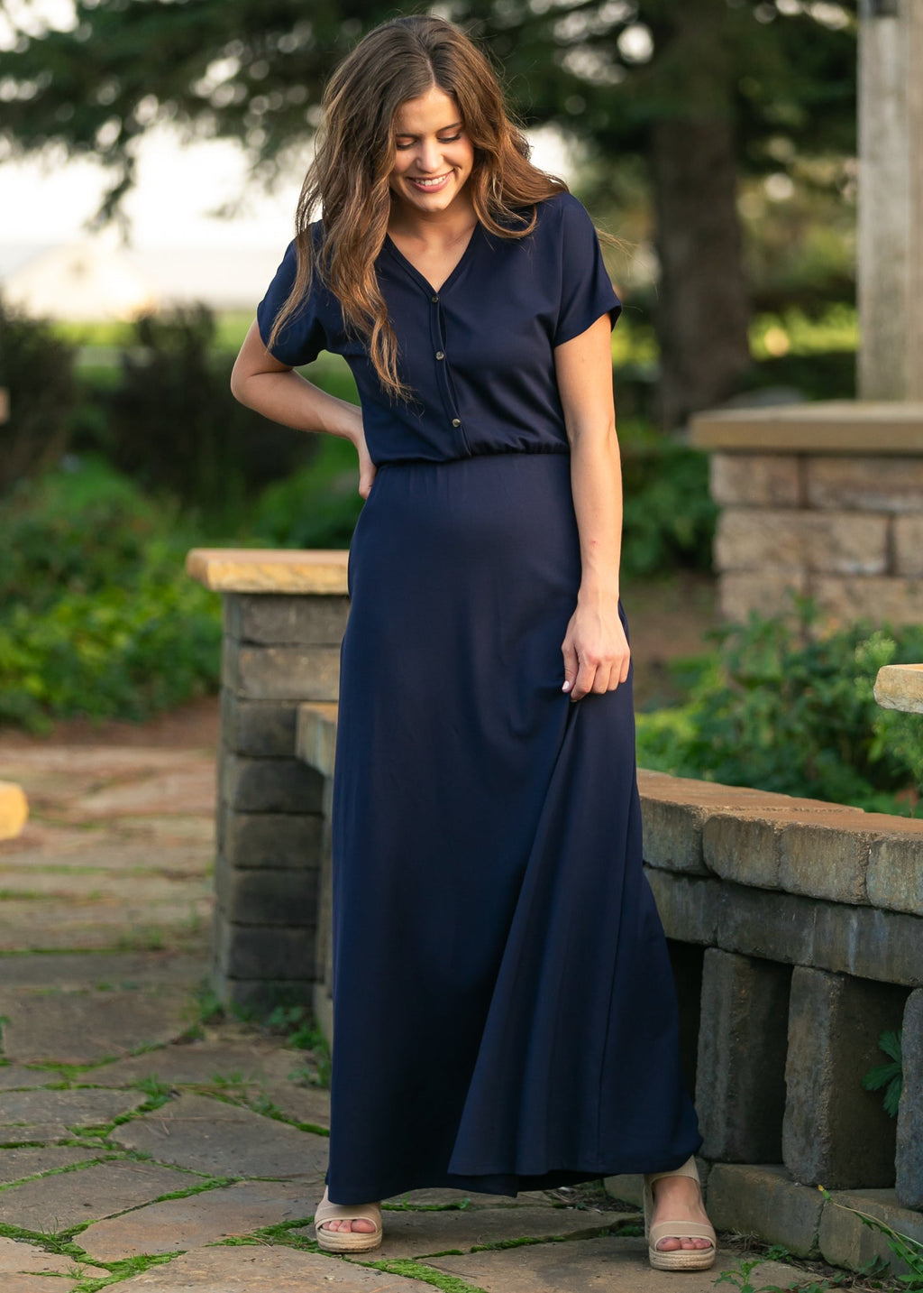 Navy short-sleeve maxi dress with cinched waist and button-front V-neck