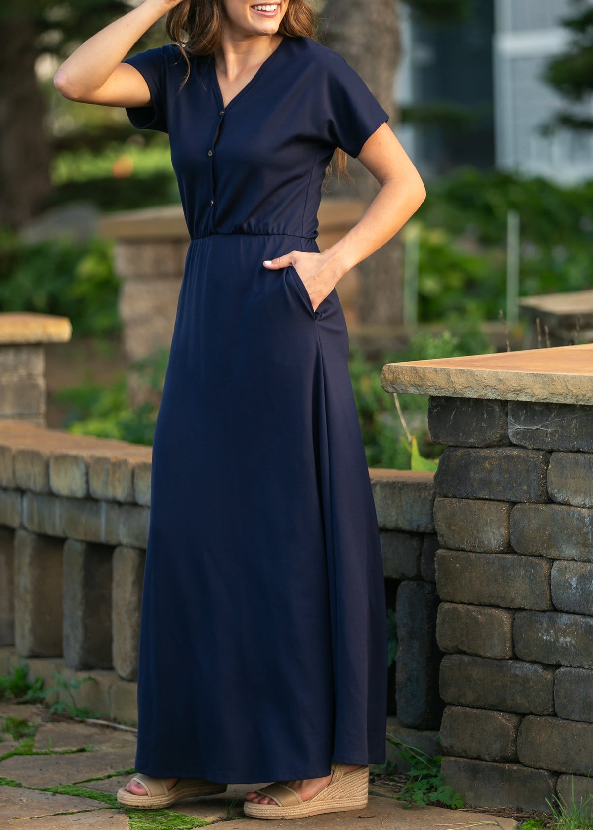 Navy V-neck maxi dress with short sleeves and cinched waist seam detail