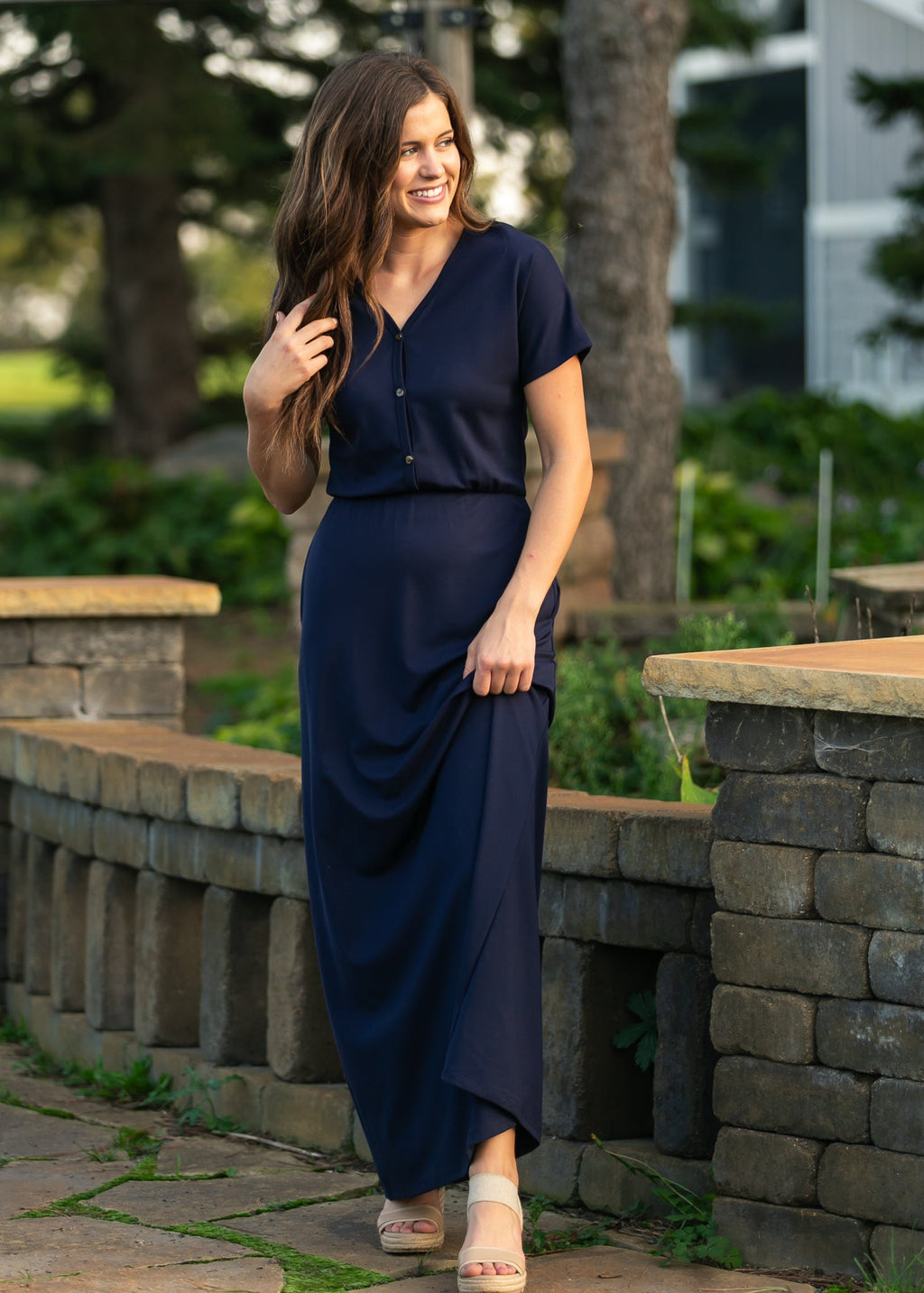 Navy cinched-waist maxi dress with short sleeves and V-neck button detail