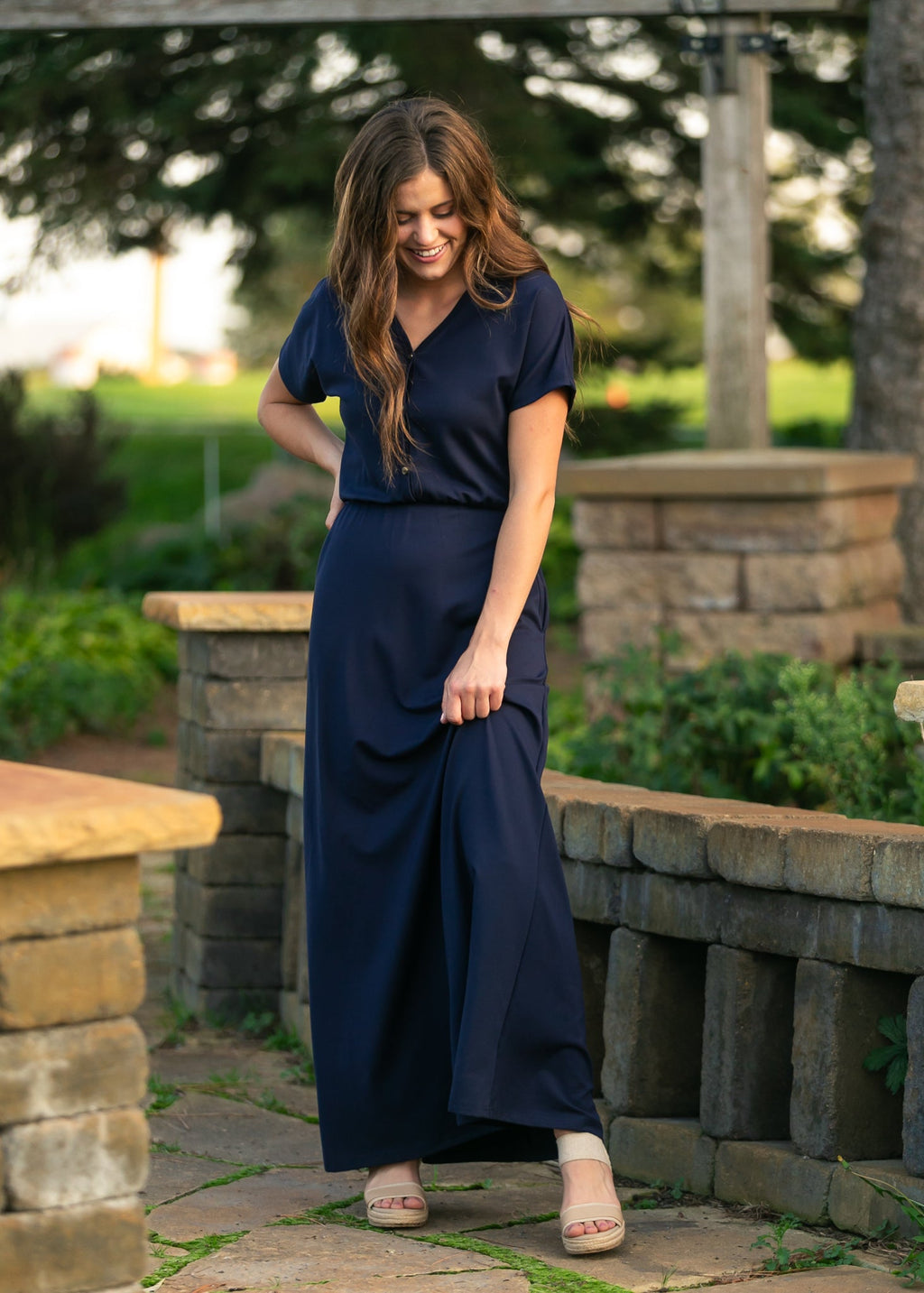 Navy short-sleeve maxi dress with cinched waist and button-front V-neck