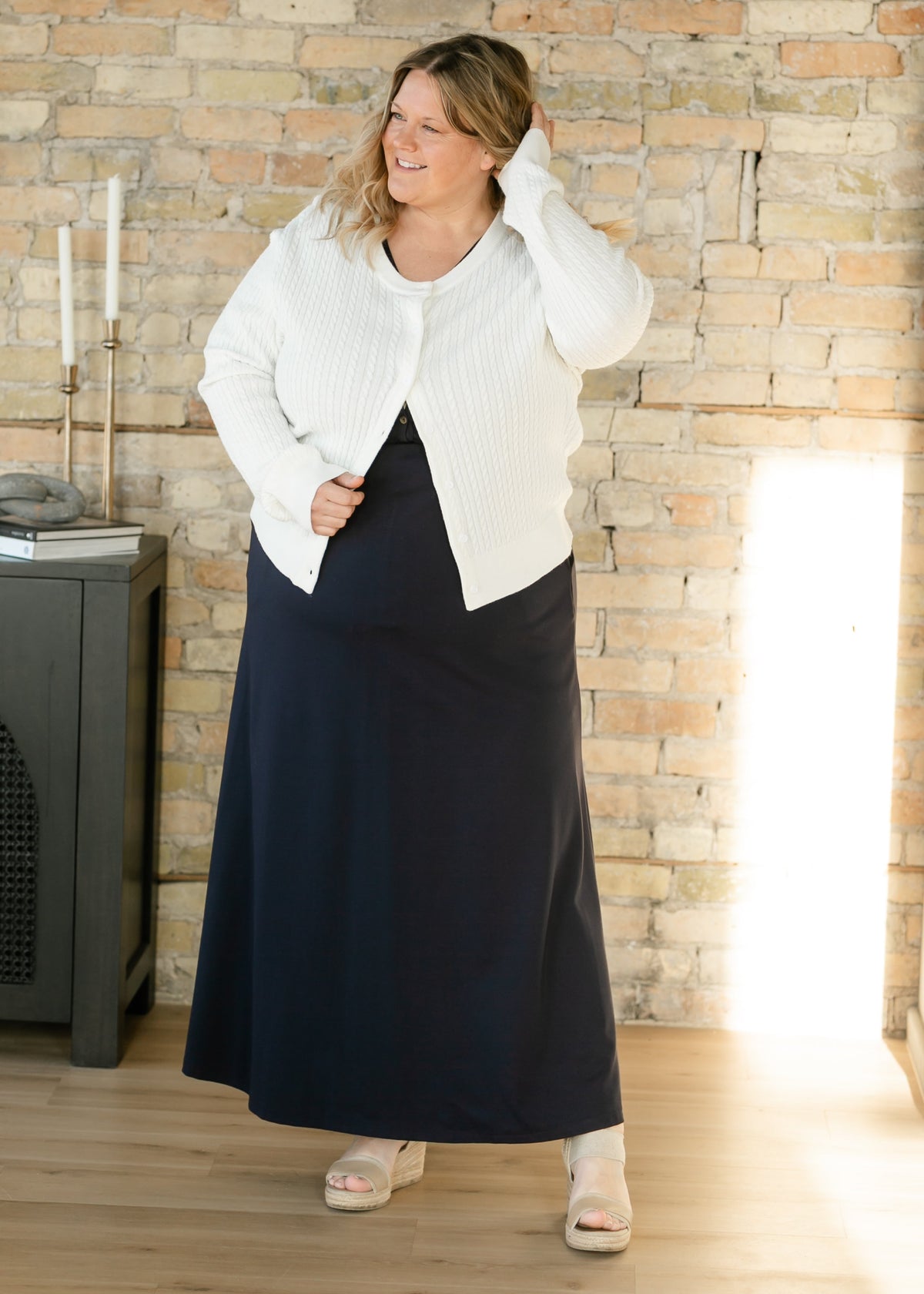 Navy maxi dress with cinched waist, short sleeves, and button-front V-neck