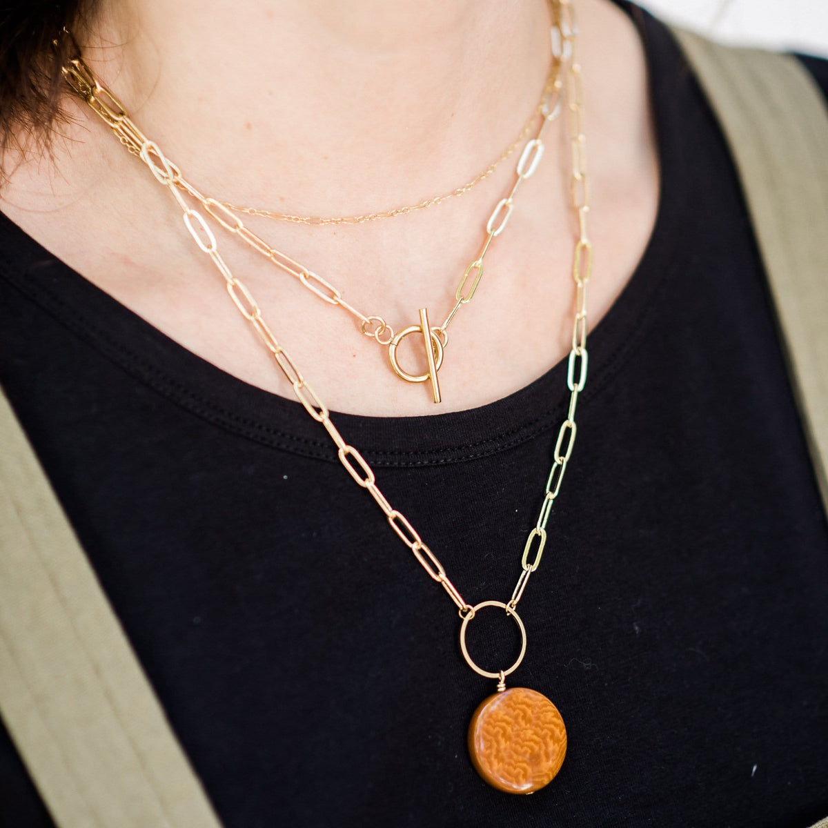 Gold-tone oval-link necklace with circular coin pendant