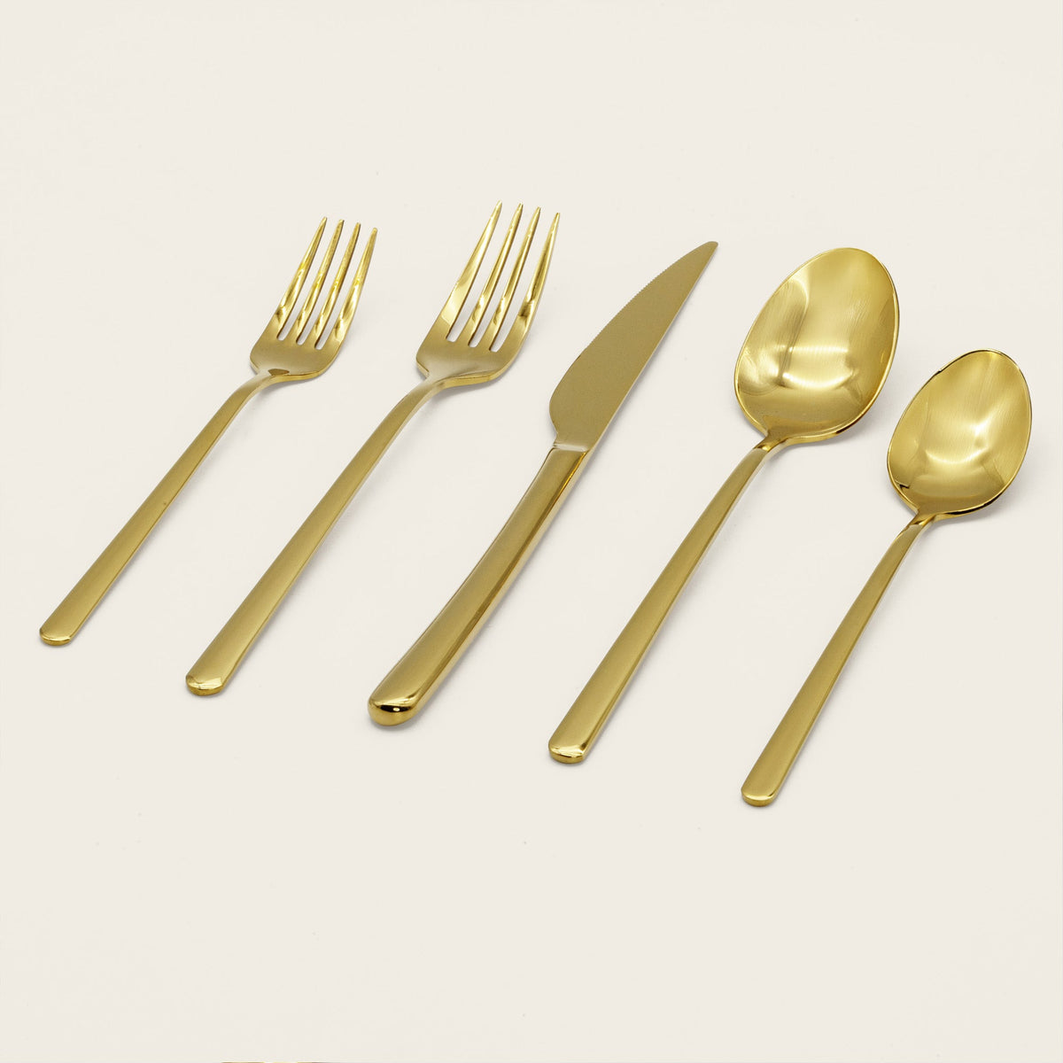 Gold mirror-finish 20-piece flatware set, neatly arranged forks and spoons
