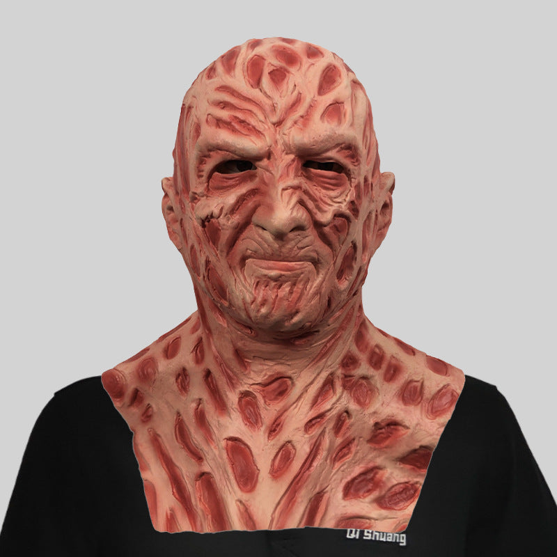 Full-face horror mask with wrinkled red prosthetic texture and exposed mouth