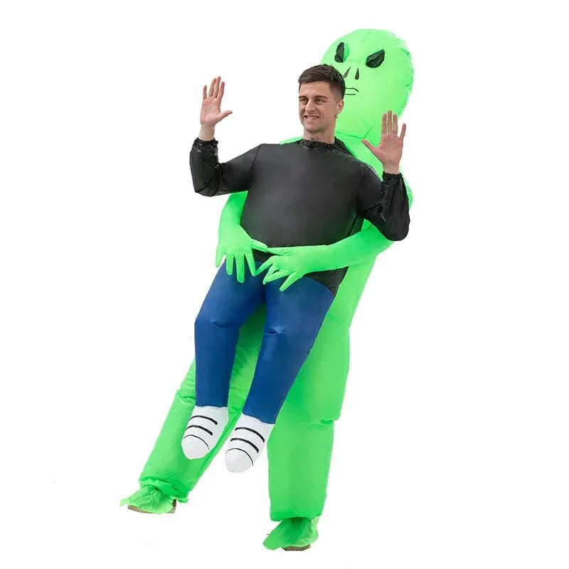 Inflatable alien costume with green head, black belly, blue pants, white striped feet, claw arms