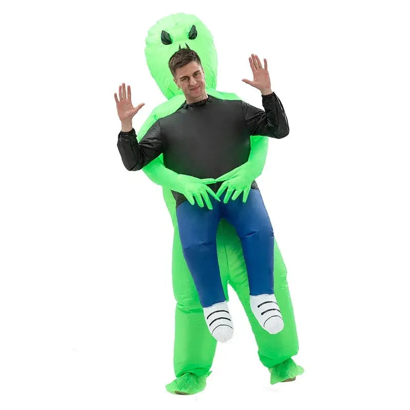 Green inflatable alien costume with black torso, blue pants, claw hands, and raised arms