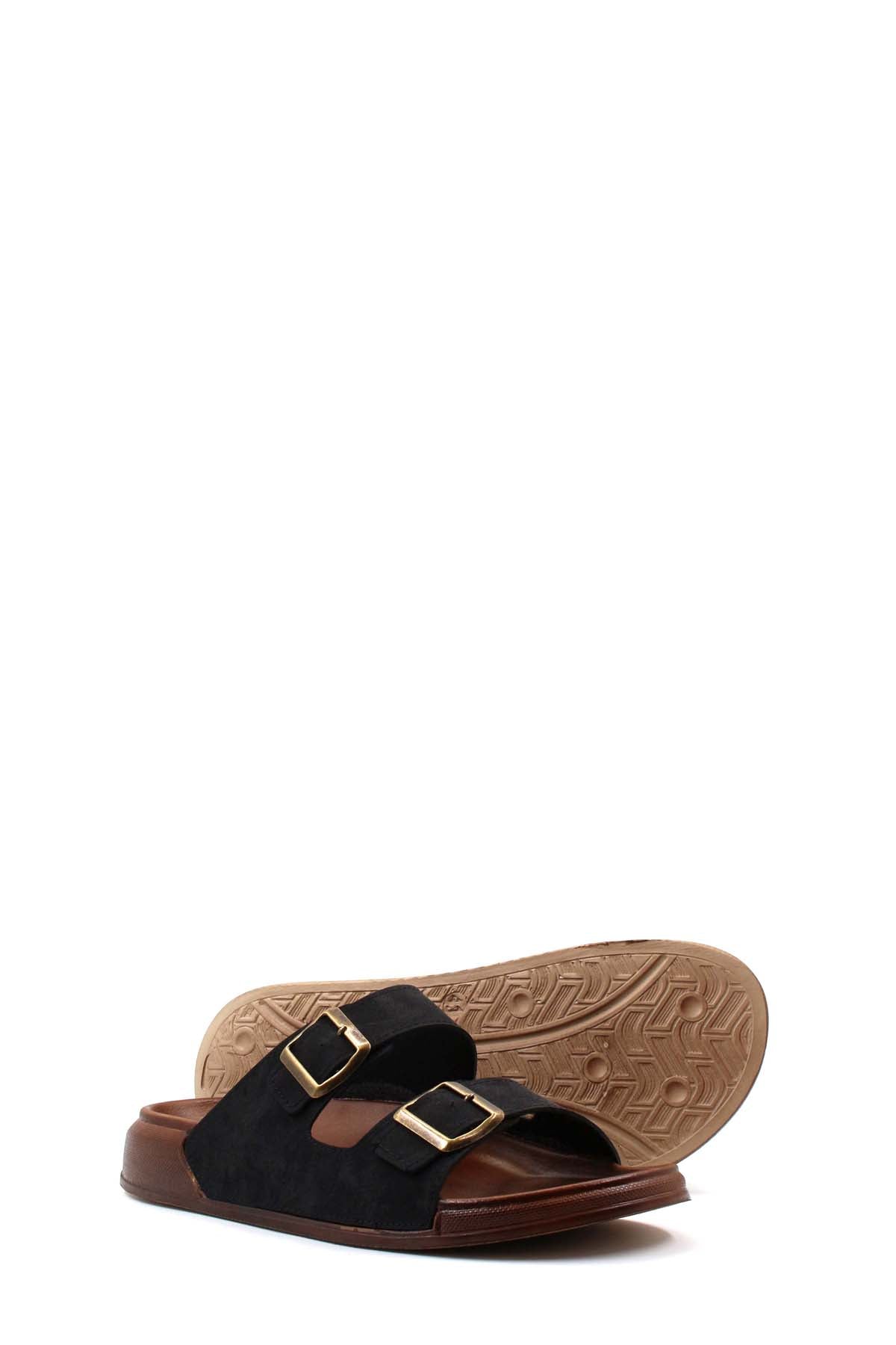 Black double-buckle slide sandals showing treaded outsole and metal buckles