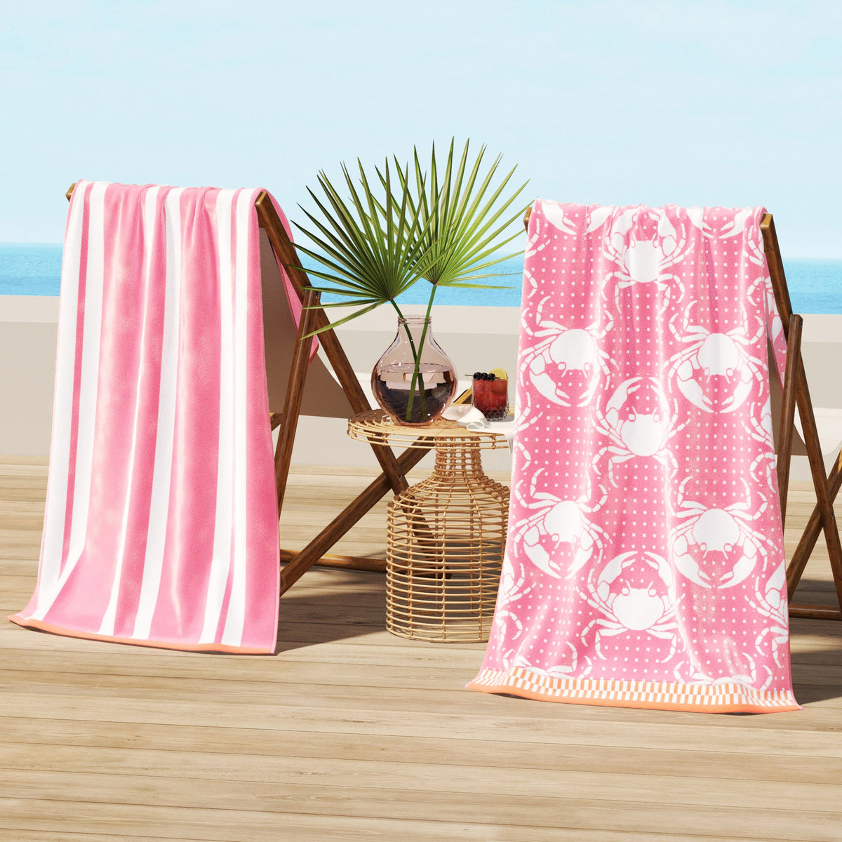 Pink and green cotton velour beach towels on wooden beach chairs