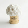 White rose superdome box with cream-white roses in gold cylindrical base